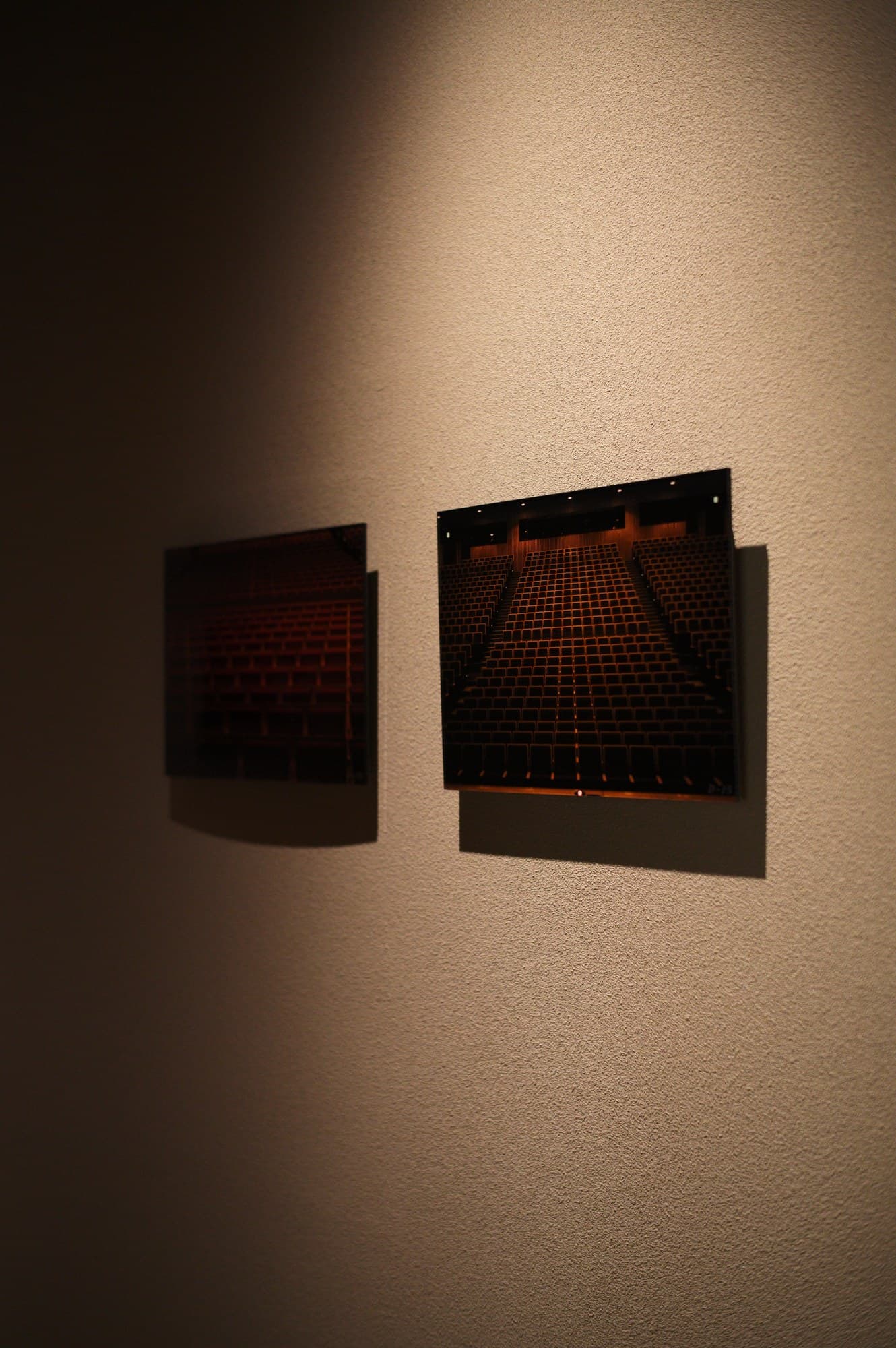 The same series, on a different wall: two works hung at an angle