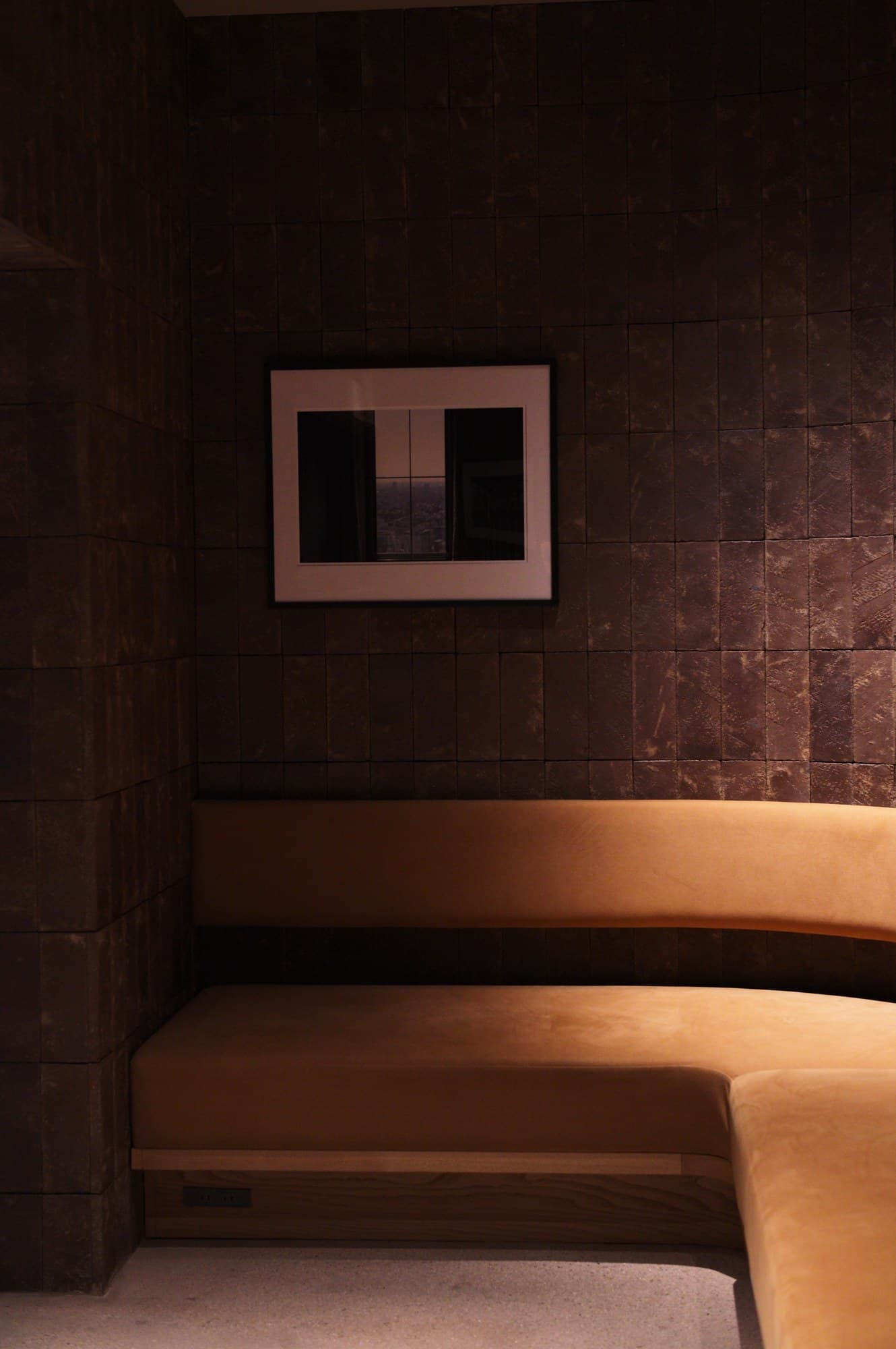 A different work from the auditorium series, hanging on the same wall: a view of the city through a window